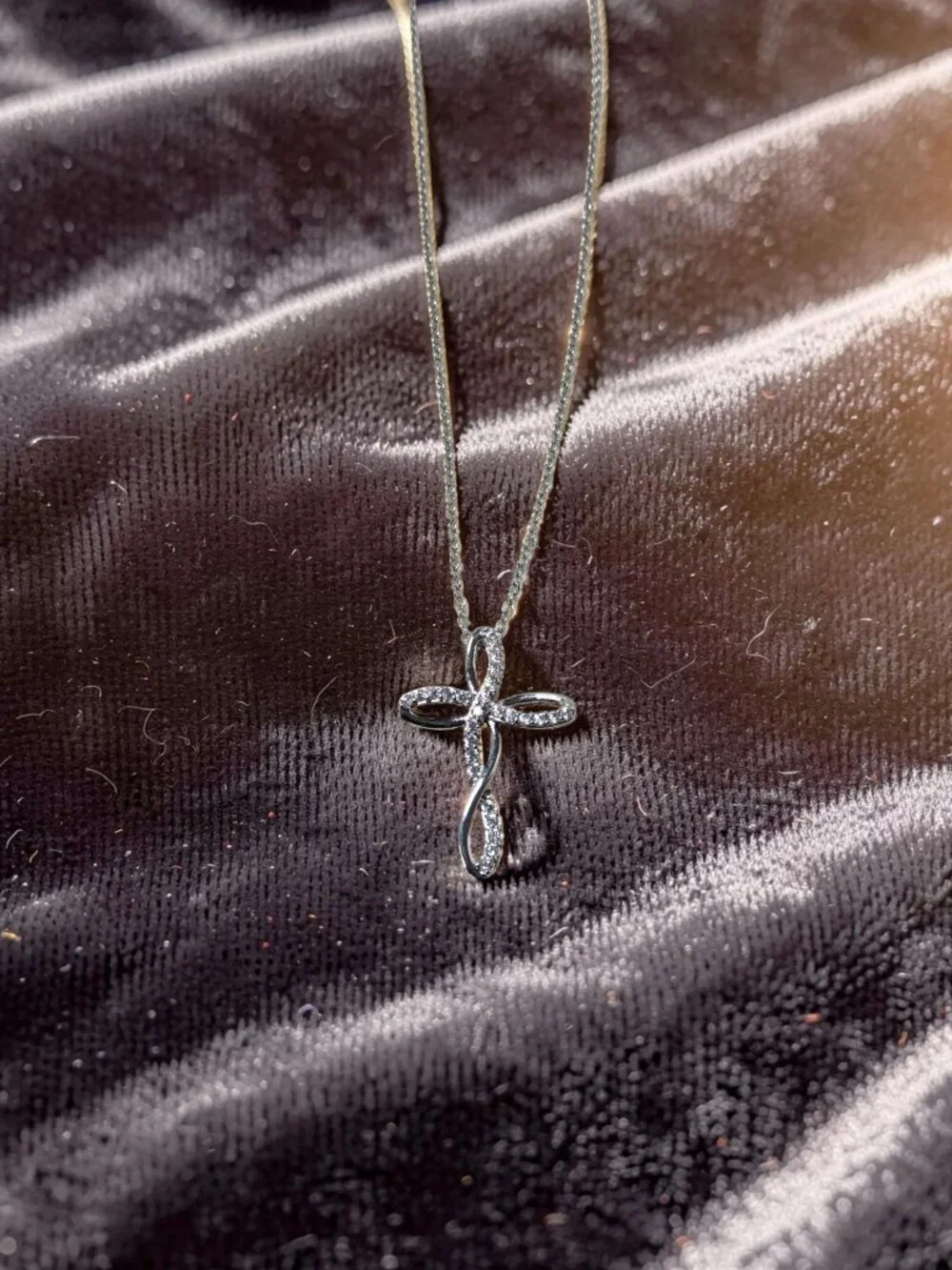 vintage Chrystal lined spiraled curled cross on a .925 sterling necklace